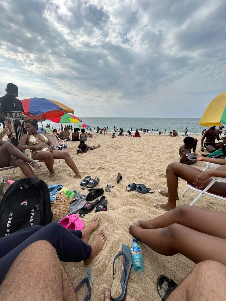 Ada Foah beach with colorful umbrellas along the coast