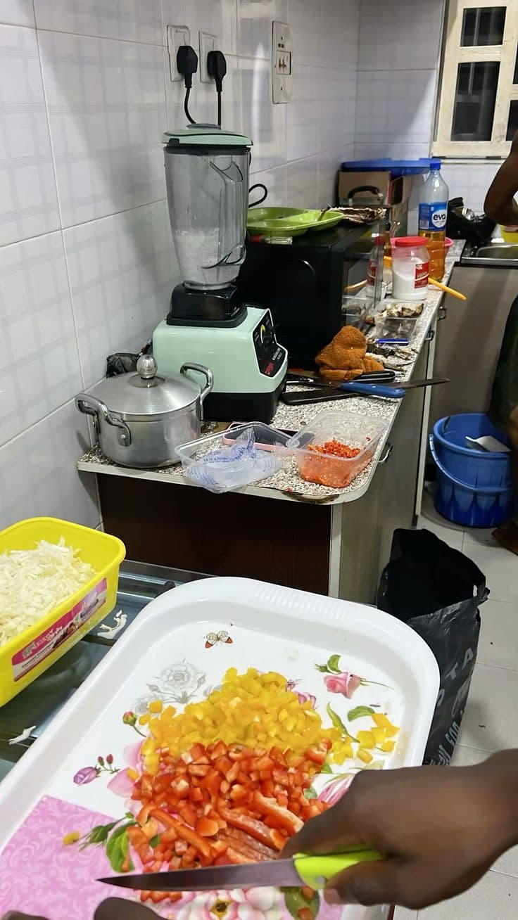 Kitchen with blender and fresh vegetables being prepared