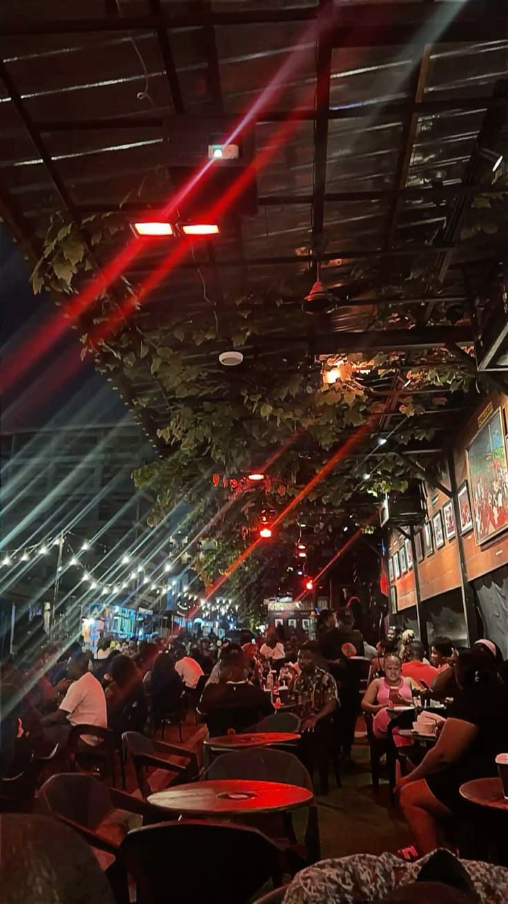 Outdoor bar with patrons enjoying music
